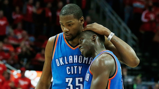 Kevin Durant embraces Thunder teammate Reggie Jackson during Game 4. 